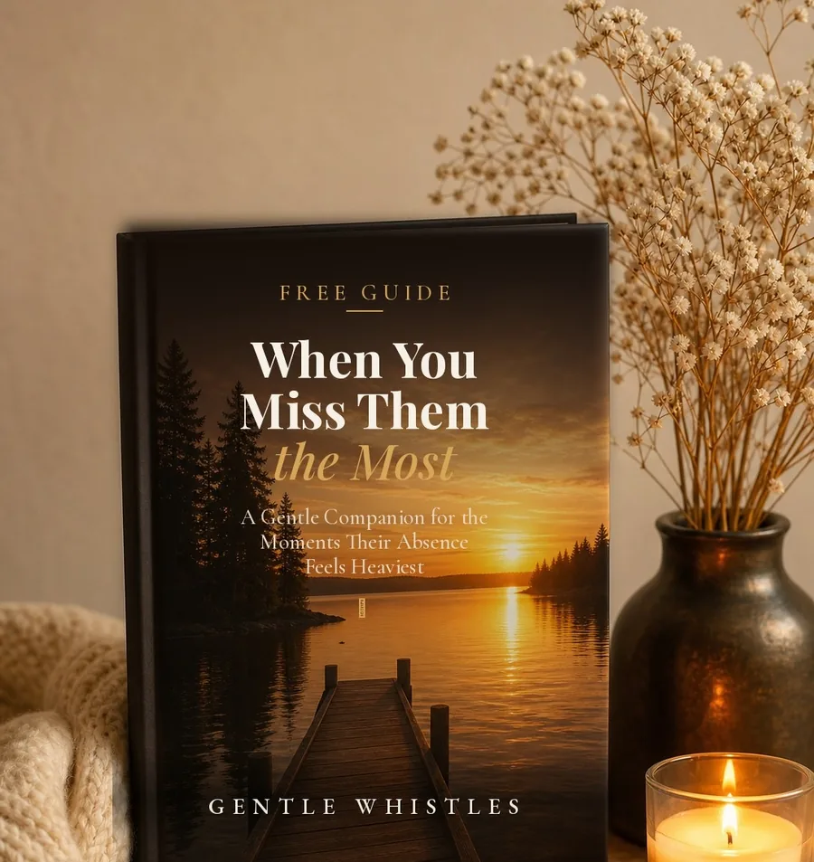 When You Miss Them the Most — a gentle companion guide resting beside soft candlelight and baby's breath