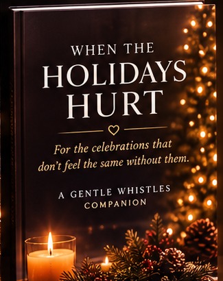When the Holidays Hurt companion guide standing beside a glowing candle, pine branches, berries and soft holiday lights